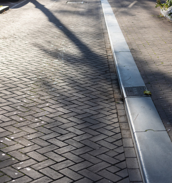 Street and sidewalk separated by a curb