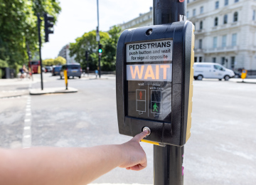 Pedestrian crossing, green light button.