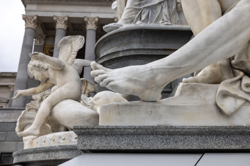 Foot, fragment of a marble sculpture in front of the Austrian Parliament building in Vienna