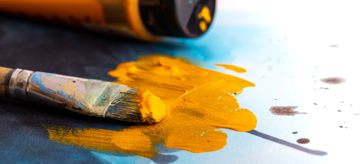 Brush, yellow paint, artistic painting