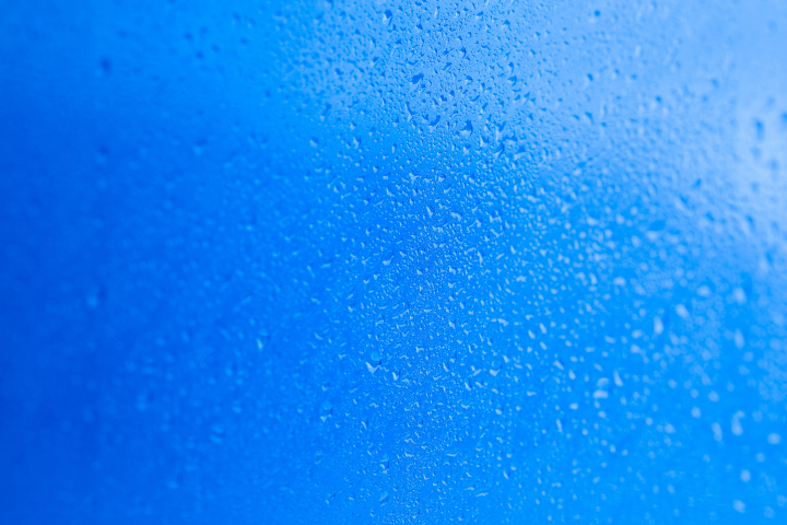 Cold water drops on the glass